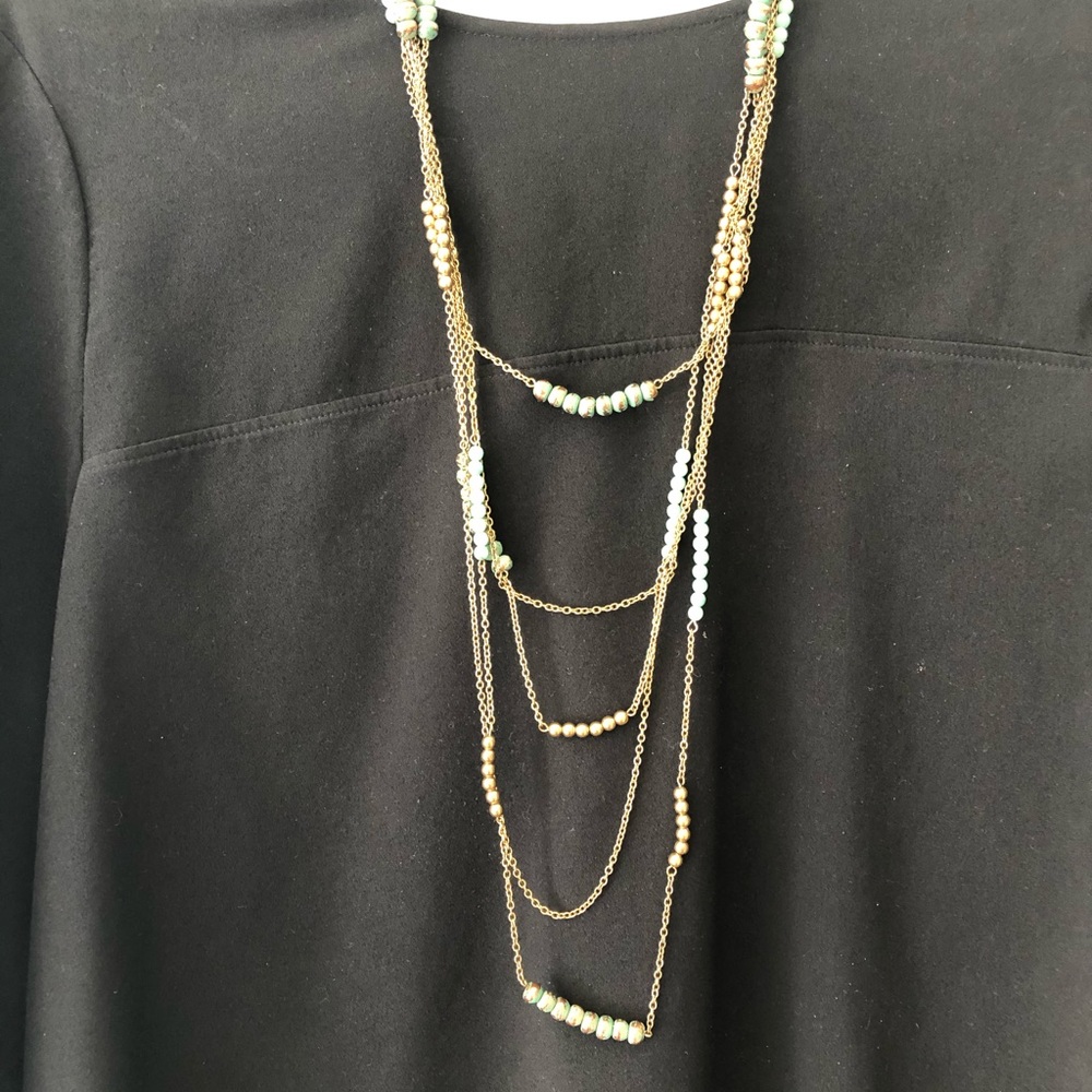 Gold, multi-strand necklace with turquoise detail